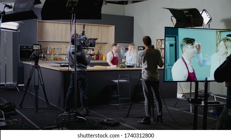 WIDE Behind The Scenes Of Studio Set, Makeup Artist Make Corrections During Shooting Television Cooking Show Featuring Celebrity Chef, Professional TV Production