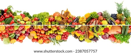 Wide composition of bright multi-colored fruits, vegetables and berries isolated on white background.