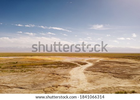 Wide deserted land with curve path.