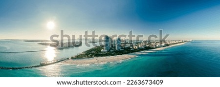wide drone shot of the port of miami florida during a bright sunny day. Miami Beach, wonderful aerial view of buildings, river and vegetation. Panorama view of Miami Beach, South Beach, Florida, USA.