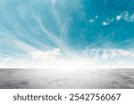 Wide empty grunge cement street ground on blue sky clouds white light background for business product windy scene, blue sky empty land back a concrete texture road cutting through, as clouds drift way