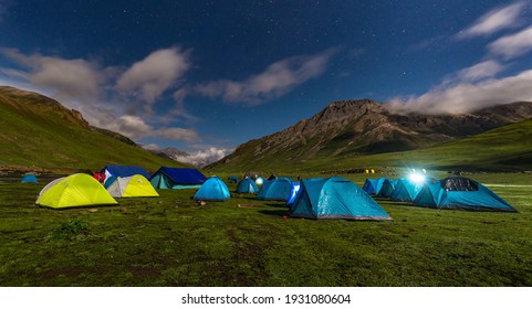  wide field long exposure photo  of Kashmir Great Lake Night time astrophotography, cloud and star with camping tents - Shutterstock ID 1931080604