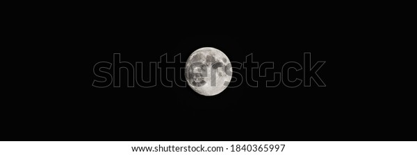 Wide full moon on black sky background. Night\
sky wallpaper over the city. Cityscape glowing moon phase.\
Mysterious astronomy night light. Science cosmos midnight circular\
luminescent moon.\
Werewolf\
