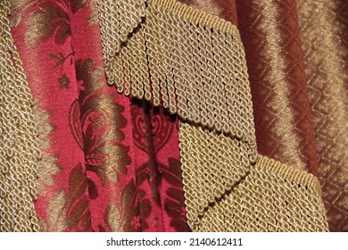 A Wide Gold Fringe On A Red Curtain. Backgrounds