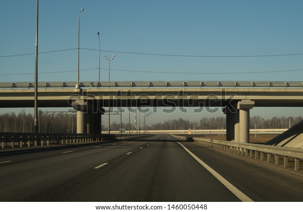 Wide\
highway. long roadway. road going into the\
distance