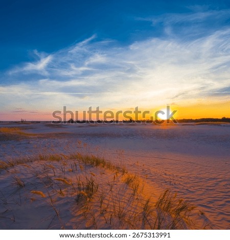 wide hot sandy desert at the dramatic sunset