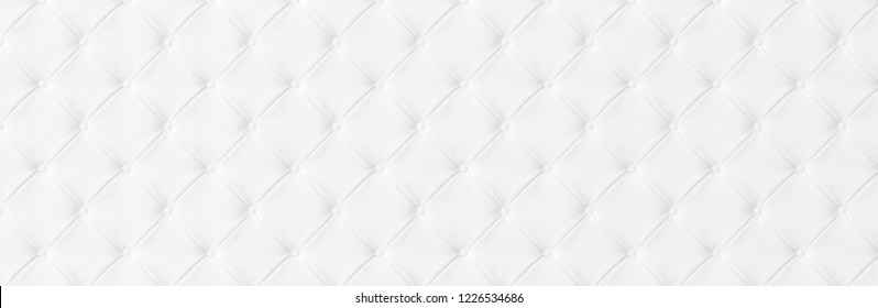 Wide Light white luxury upholstery sofa texture background concept clean gray vintage leather furniture tufted pattern wallpaper, closeup chester elegant armchair mattress buttons surface, material.