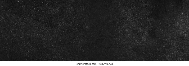 Wide old black wood chalkboard food bg background texture in college concept back to school classroom wallpaper for Black Friday bacground dust white chalk grunge. black stone cement wall blackboard.