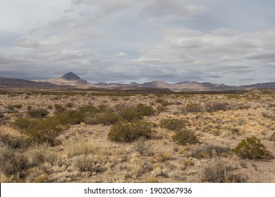 Wide Open Desert Vista Leading To Gorgeous Mountain Range In Rural New Mexico