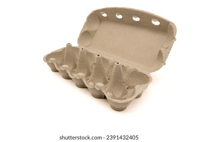 Wide open empty egg box for ten eggs, isolated on white with copy space. Carton pack, egg-container for packaging.