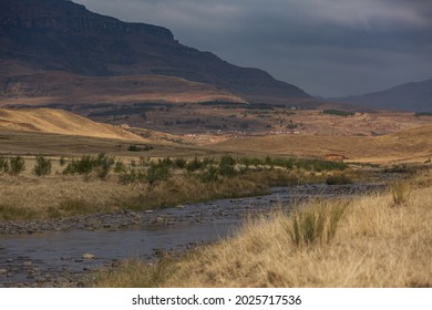 Wide Open Landscape With A River And Mountain