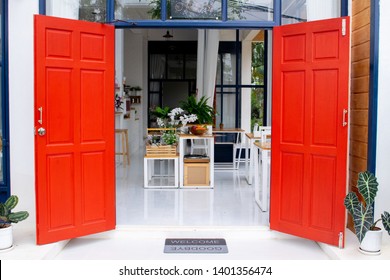 wide open red door into cafe colorful enter design red and blue very bright picture