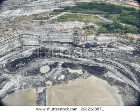Wide Open-Pit Mining Site With Distinct Coal and Sediment Layers