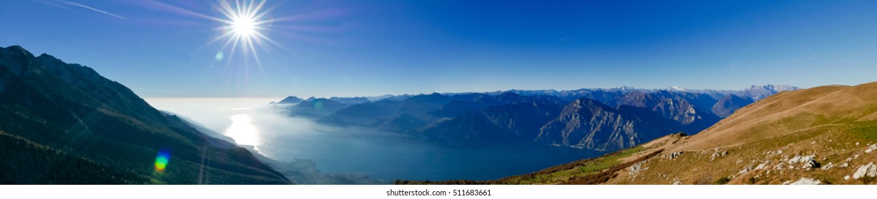 Wide panorama of alpine lake Garda seen from Monte Baldo, Italy - Powered by Shutterstock