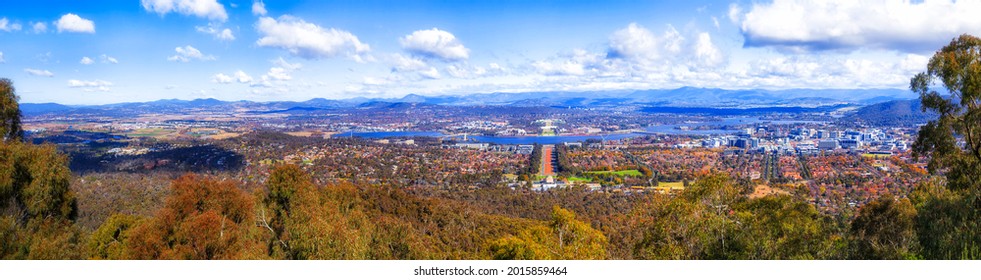 Wide panorama of Australian Capital territory - Canberra city on shores of Lake Burley Griffin on a sunny day.