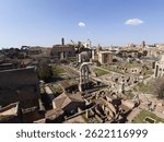 A wide panorama captures the heart of ancient Rome, showcasing temples, arches, and remnants of the city’s glorious past.