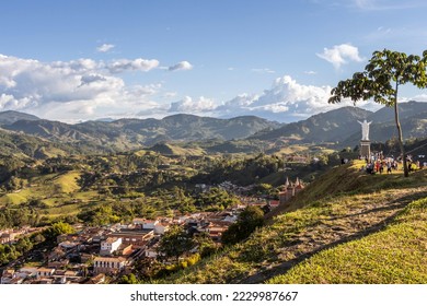 Wide panorama of the superb village (pueblo) of Jerico, antioquia, Colombia, with a blue sky and the Andes Mountains in the background. Picture taken from El Morro El Salvador. - Shutterstock ID 2229987667