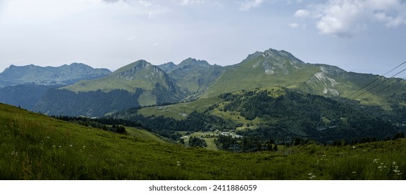 Wide panorama view from the top of Belvedere showing green slopes of Alpine lanscape with French Alps during summer. Outdoor mountainous sports.  - Powered by Shutterstock