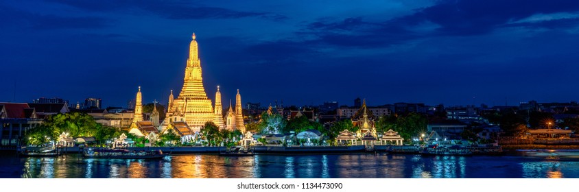 Wide panorama of Wat Arun temple at magic hour, Bangkok, Thailand
