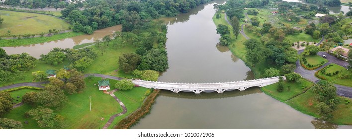 Wide panoramic photo of the white bridge in the Japanese garden of Singapore