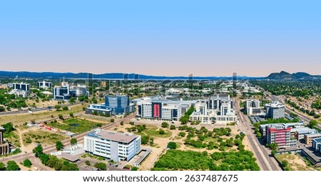 A wide panoramic shot displaying the evolving skyline of Gaborone city, highlighted by its modern skyscrapers and urban development, Gaborone, Botswana