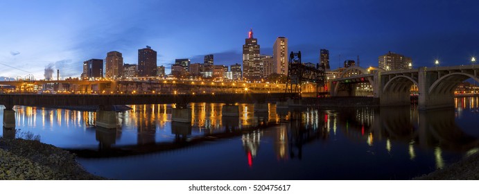 A Wide Panoramic Shot of the Skyscrapers of Downtown St Paul, Minnesota Reflecting Across the Mississippi River during an Autumn Twilight