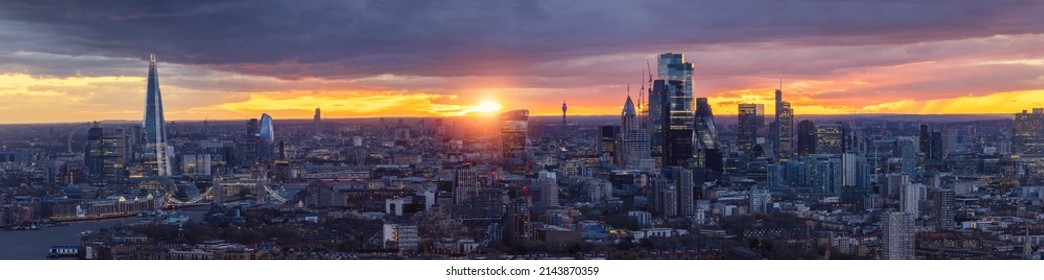 Wide Panoramic View Of The 2022 Skyline Of London During Dusk From Westminster To The City With Illuminated Skyscrapers A Colorful Sky