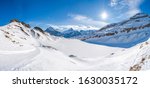 Wide parnoramic view of snow covered Swiss Alps from First mountain in Grindelwald ski resort, Switzerland