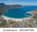 Wide shot of the aerial view of the coast of Hout Bay in Cape Town, South Africa.