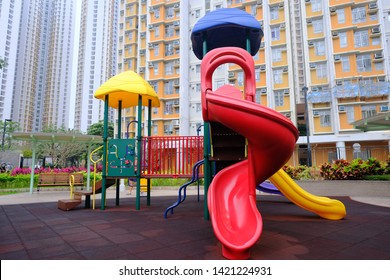 Wide Shot Of Children Playground And Park And Housing Background