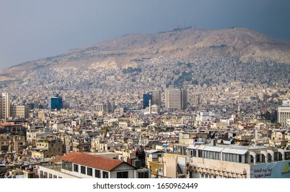 Wide Shot Of The City And Mount Of  Qasioun Mountin In Damascus, Syria, 30/12/2019