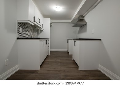 Wide Shot Of A Finished Basement Kitchen