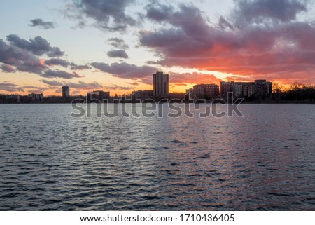 A Wide Shot on a Dramatic Sunset over Bde Maka Ska and Residential South Minneapolis