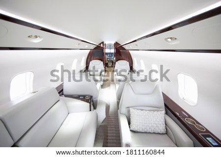 A wide shot showing interiors of a private jet.