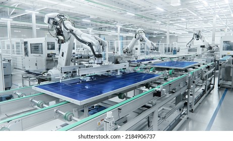 Wide Shot of Solar Panel Production Line with Robot Arms at Modern Bright Factory. Solar Panels are being Assembled on Conveyor.