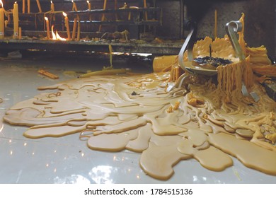 Wide Spread Of Melted Big Candle Wax On Tile Floor In The Temple