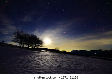 wide spread snow field at night - Shutterstock ID 1271431186
