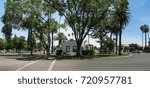 Wide view of the historic Patterson California Circle Plaza in the Central Valley shows the Historical Society Museum building from 1910, center.