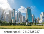 Wide view Hong Kong of skyscrapers and residential area square in city park with monument Sun Yat Sen Statue