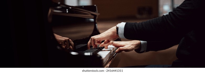 Wide view image of male hands in elegant suit playing black concert piano. Closeup view. - Powered by Shutterstock