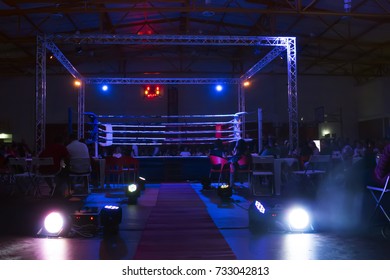 Wide View Of A Kickboxing Event Inside A Warehouse.