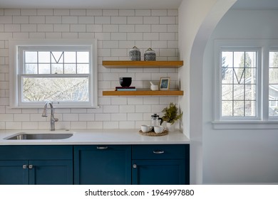 Wide View Of Newly Remodeled Kitchen With White Tile And Painted Blue Cabinets.