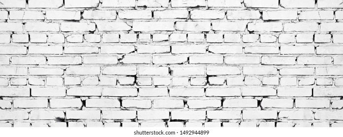 Wide White Brick Wall Texture. Old Rough Whitewashed Brickwork. Grunge Background