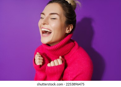 Wide-angle closeup portrait of cheerful woman wearing warm polo neck sweater against purple background - Shutterstock ID 2253896475