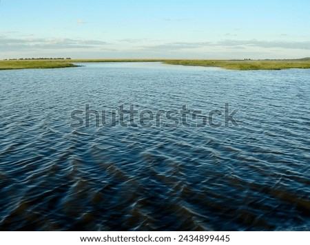 Wideangle shot of the Chobe river from a boat in Chobe National Park, Northern Botswana, Africa.