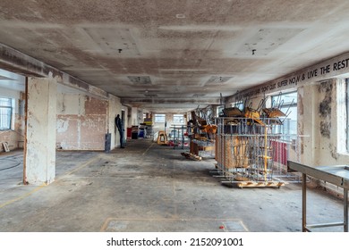 A wide-angle shot of an interior of a commercial office space currently under contsruction in London, England, United Kingdom