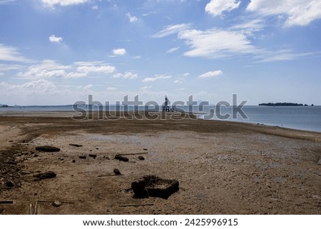 A wide-angle view captures a beach during low tide