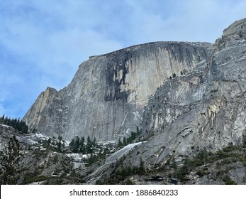 Wider angle of Half Dome face with light snow from dry Mirror Lake at Yosemite National Park.