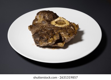 Wider view of a side Angle of a cooked beef shank