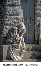 Widow While Weeping Marble Statue Outside A Tomb Cemetery